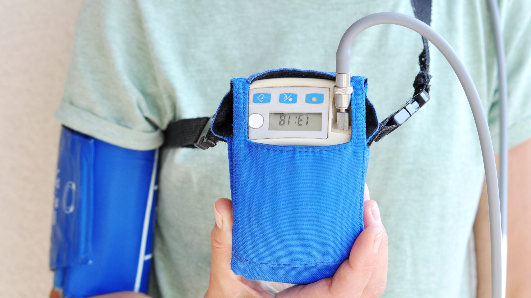Patient wearing Holter monitor for continuous cardiac health monitoring in a private clinic, Cardiac Monitoring Services for Clinics