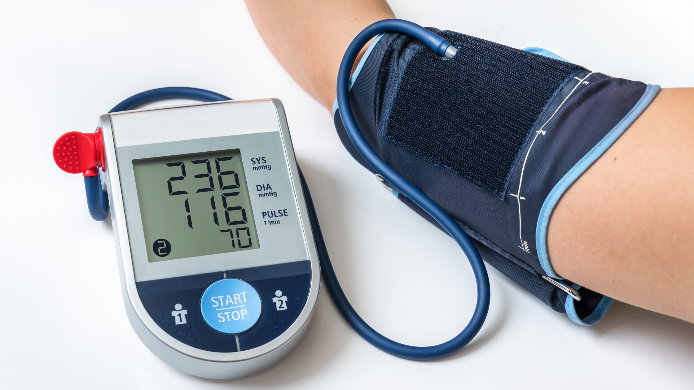 Patient wearing ambulatory blood pressure monitor for 24-hour continuous monitoring in a clinic, Cardiac Monitoring Services for Clinics