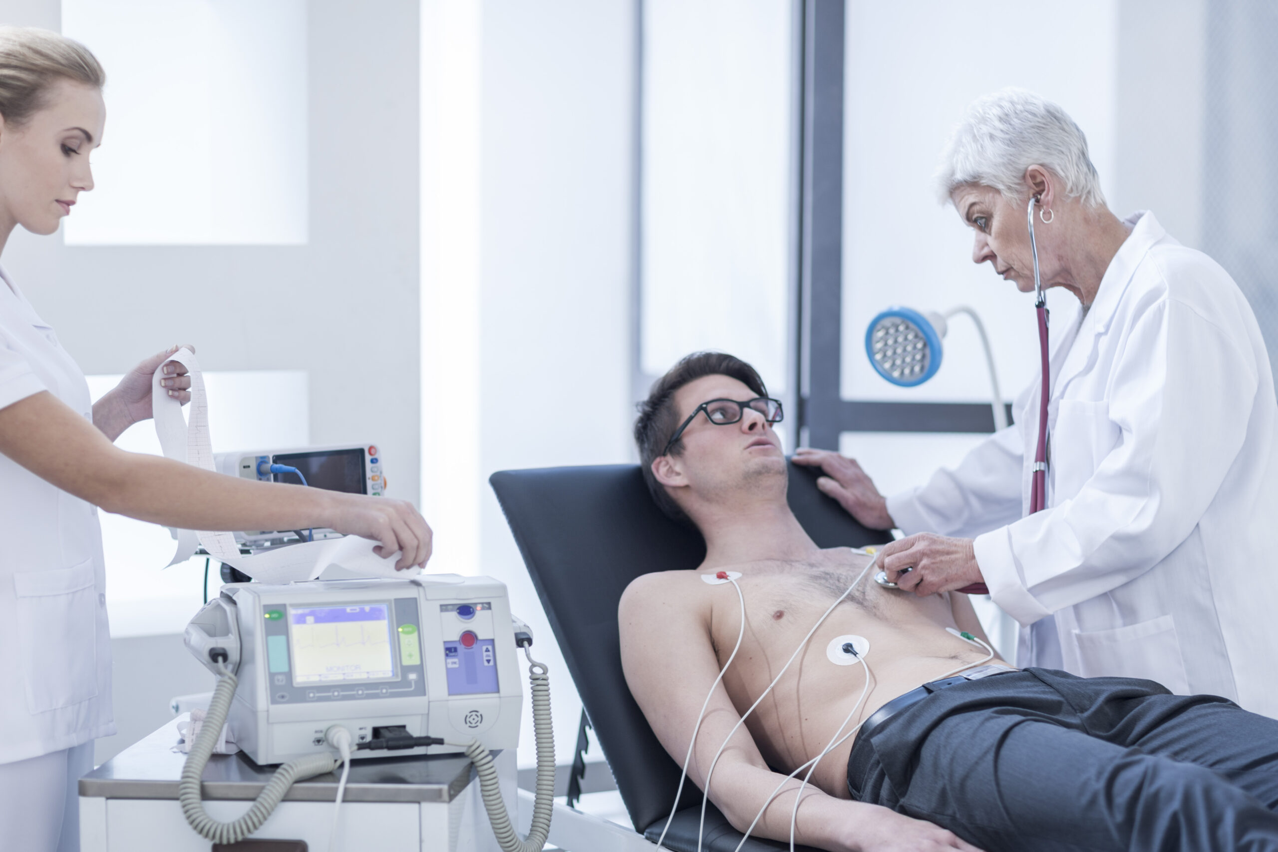 Young man in hospital getting heart rate monitored Reliable Local Electrocardiogram Provider
